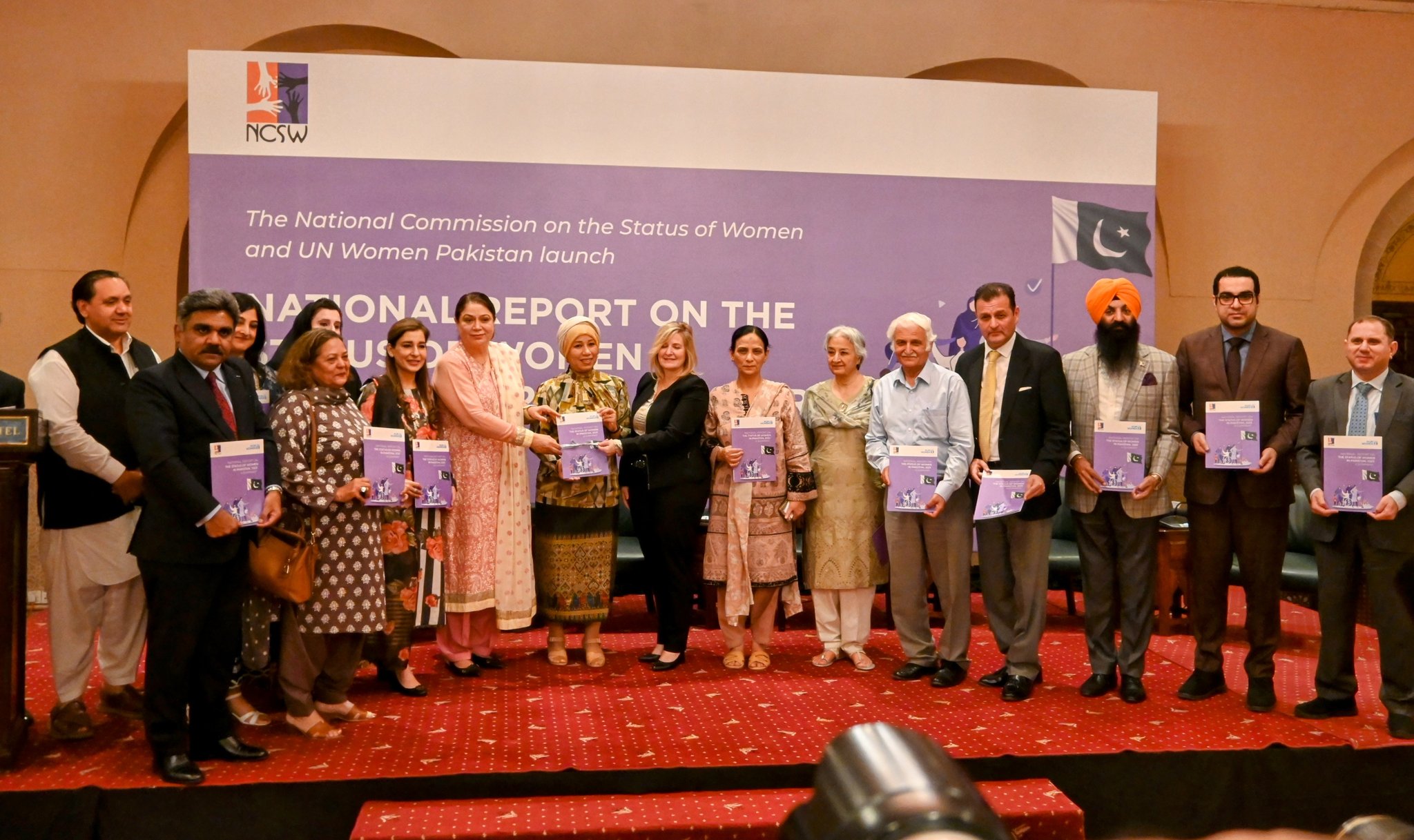 Participants pose for a group photo at the launch ceremony of National Report on the Status of Women in Pakistan. 